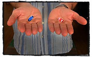 Two hands, holding a blue pill and a red pill